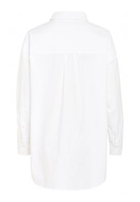 White long-sleeve shirt, collared, with a straight hem and buttoned cuffs. Smooth texture, minimalistic design, no visible patterns.
