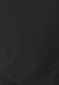 Black cotton fabric, soft texture, smooth surface, no visible patterns or accents, uniform color throughout. No discernible design features.