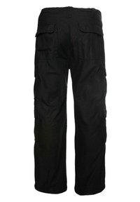 Black cargo pants made of durable fabric, featuring multiple side pockets, a relaxed fit, and elasticized cuffs at the ankles.