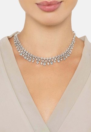 Silver necklace with teardrop and round clear crystals, featuring a graduated design and a delicate chain for fastening.