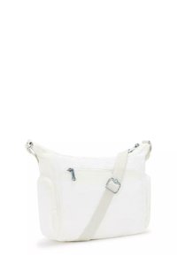 White canvas shoulder bag with a long adjustable strap, featuring a zippered front pocket and additional side pocket. Smooth texture.