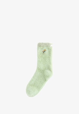 Sosete pufoase de culoare verde deschis, cu flori mici brodate în nuanțe de portocaliu și alb aproape de vârf și un mansetă de culoare crem.