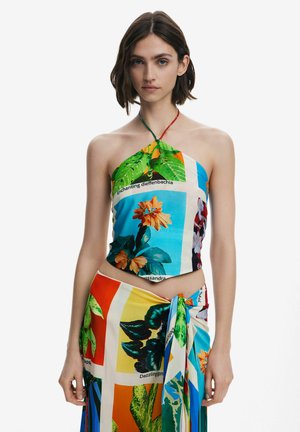Colorful halter crop top and wrap skirt featuring a floral pattern with text labels, made from soft fabric with a smooth texture.