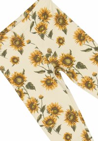 Leggings color crema con un motivo di girasoli gialli e marroni, con foglie verdi. Tessuto liscio con una vestibilità elastica.