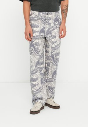 Loose-fit, patterned trousers in shades of gray and cream, featuring a wave design. Made from lightweight fabric with a button closure.
