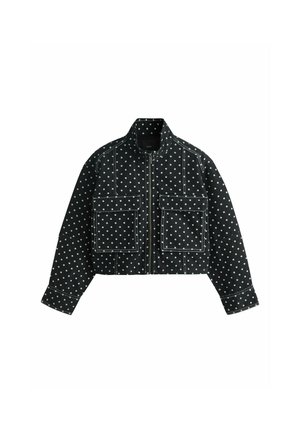 Must kraeplintidega jakk valgete täppidega, ees tõmblukk, kaks suurt esist klapiga taskut ning pikad varrukad õmblusega detailidega.