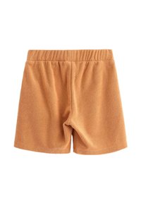 Shorts lavet af blødt, tekstureret stof i en varm orange nuance, med elastisk talje og et enkelt, udekoreret design.