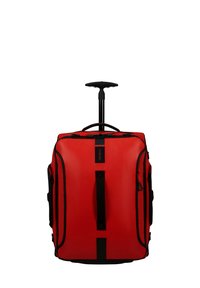 Red wheeled duffel bag with a telescopic handle, black accents, sturdy grip handles, and multiple zippered pockets. Made of durable material.