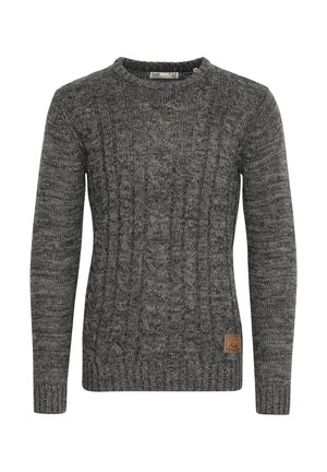 Gray knitted sweater featuring a cable pattern, round neckline, and ribbed cuffs. Includes a small brown leather logo tag at the side.