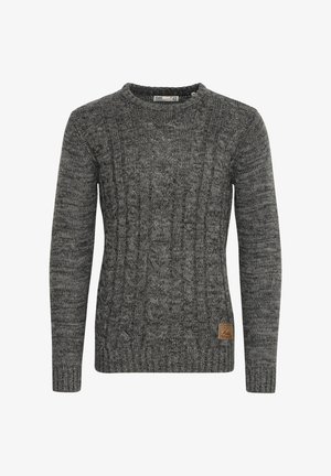 Pilkas megztinis su pynimo ornamentu, apvalia iškirpte ir tekstūrinėmis rankogaliais. Šone yra mažas rudas odinis logotipas.