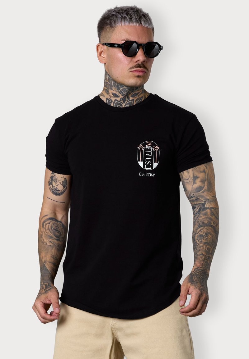 Black short-sleeve T-shirt made of cotton, featuring a small front logo with palm trees and the word "ESTEEM." Smooth texture, fitted design.