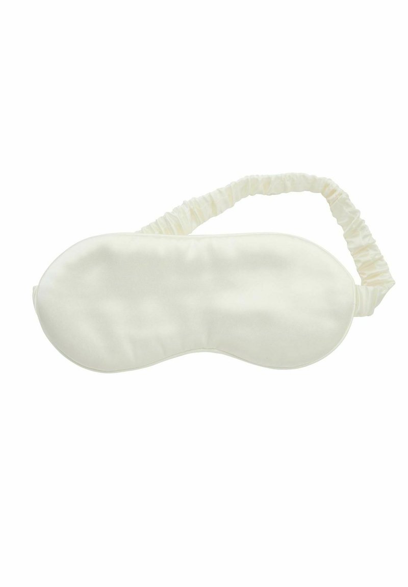 Satin sömnmask i krämfärg med en mjuk textur, formad för att passa ansiktet och ett elastiskt, rynkat band för en säker passform.
