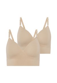 Dos sujetadores sin costuras en color beige con una textura suave, que presentan un diseño de escote en V y tirantes ajustables con accesorios de metal.