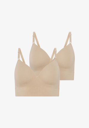 Twee beige, naadloze bh's met een zachte textuur, voorzien van een V-halsontwerp en verstelbare banden met metalen hardware accenten.