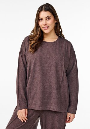 Long-sleeve, loose-fitting top in deep mauve fabric with a round neckline and soft texture, paired with matching bottoms.