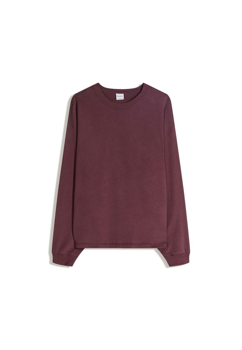 Pulóver s dlhými rukávmi v tmavobordovej farbe, vyrobený z jemnej látky. Má okrúhly výstrih, voľný strih a rebrované manžety s rovnou lemovkou.