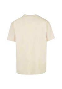 Creme T-Shirt mit kurzen Ärmeln aus weichem Baumwollstoff, ausgestattet mit einem klassischen Rundhalsausschnitt und einer lockeren Passform. Keine sichtbaren Muster oder Grafiken.