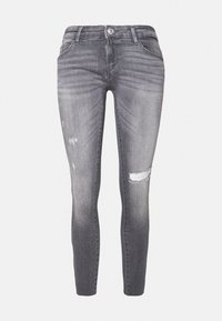 Smala jeans i blekt grå denim, med en slitning på knäet som har en reva, femficksdesign och subtila slitningar.