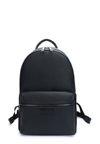 Black leather backpack with a rounded top, a front zip pocket, and adjustable straps. Features textured surface and metallic zipper accents.