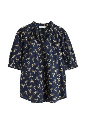 Mörkblå blommig blus i lätt tyg, med en rynkad halsringning, korta puffärmar och små vita och gula blommönster.
