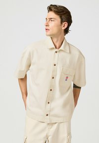 Unausgewählt, beige