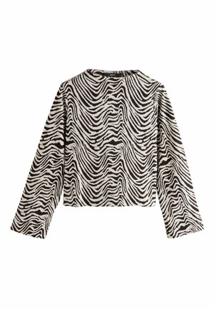 Fekete-fehér zebra csíkos, hosszú ujjú felső, kerek nyakkivágással és rövidített fazonnal. Az anyag textúrált, hullámos mintázattal rendelkezik.