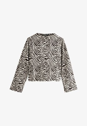 Juodai balti zebro dryžių ilgomis rankovėmis marškiniai, su apvaliu iškirpimu ir trumpu dizainu. Audinys atrodo tekstūruotas su bangų raštu.