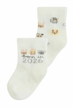 Biele detské ponožky s malými zvieracími tvárami a číslom „2026“ jemne vpleteným na jednom manžete, s motívmi zajaca, leva a koaly.