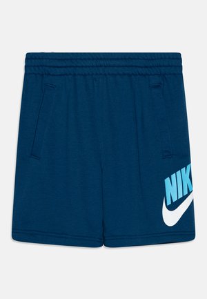 Pantalones cortos deportivos en azul marino, hechos de tejido suave, con cintura elástica, dos bolsillos laterales y un gran logotipo de Nike en blanco y azul.