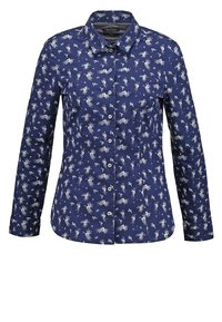 Chemise bleu marine à manches longues, boutonnée, avec un petit motif floral blanc et un col classique.