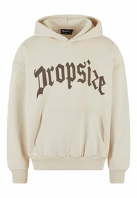 Cream hoodie made of soft fabric featuring a front pocket, ribbed cuffs, and a large dark brown "Dropsize" logo on the chest.