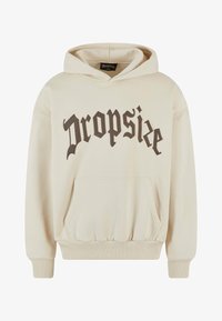 Sudadera crema hecha de una tela suave, con un bolsillo frontal, puños acanalados y un gran logo en marrón oscuro de "Dropsize" en el pecho.