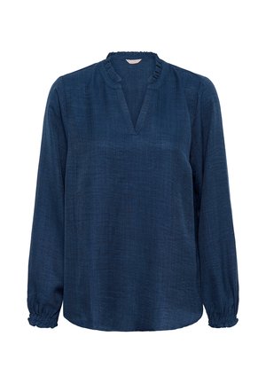 Tumši zila blūze ar garām piedurknēm, V veida kakla izgriezumu un savāktām aprocēm. Izgatavota no teksturētas auduma ar rievotu kakla detaļu.