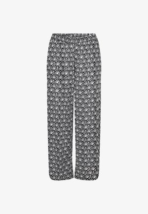 Schwarz-weiße gemusterte Hose mit elastischem Bund, lockerer Passform und geometrischem Blattdesign auf dem gesamten Stoff.