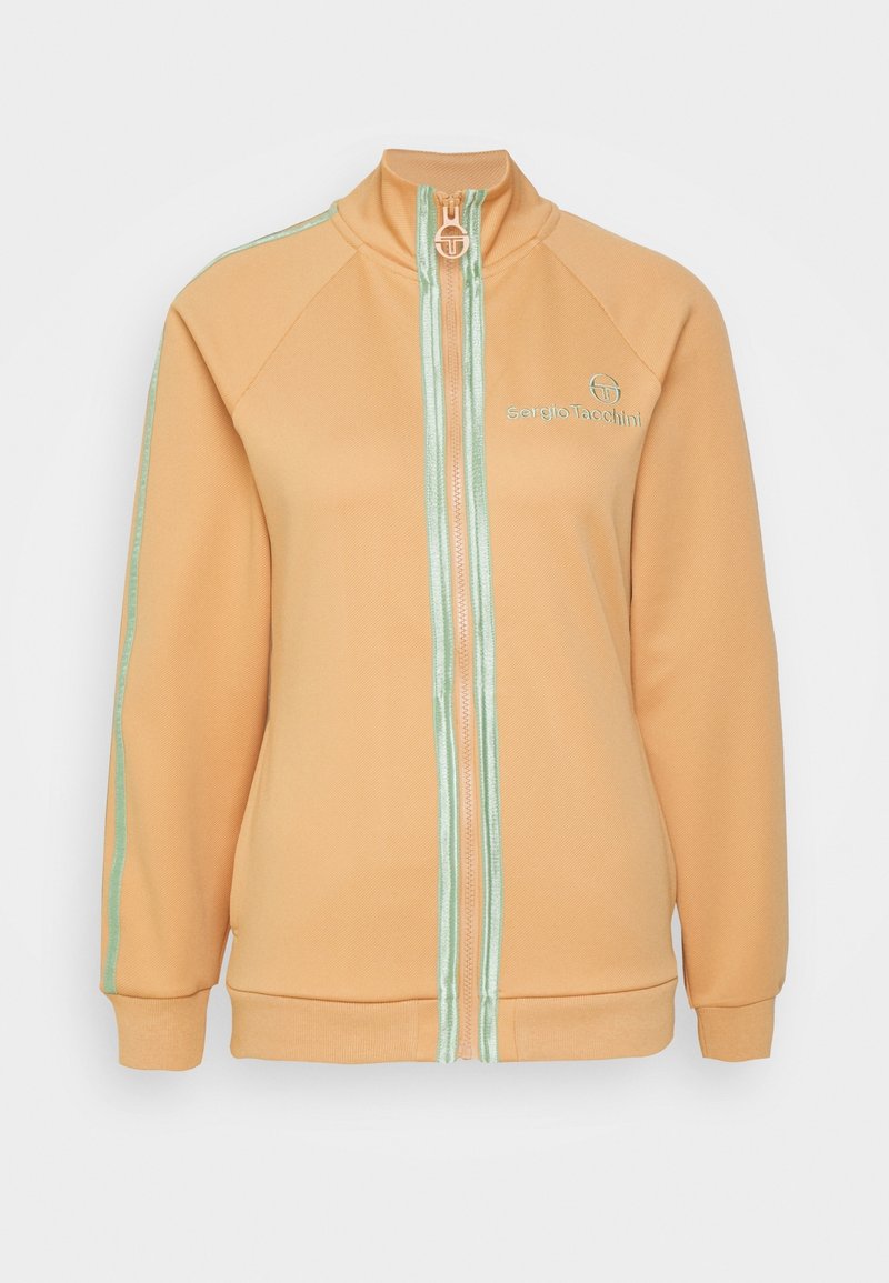 Veste zippée couleur pêche avec bordure vert menthe sur la fermeture éclair et les manches, col montant, et logo « Sergio Tacchini » sur la poitrine.
