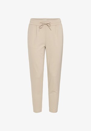 Pantalones jogger beige de tela suave, con cintura elástica con cordón, dos bolsillos frontales y perneras ajustadas para un ajuste ceñido.