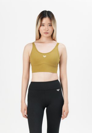 Olive green sports bra with a scoop neckline and elastic band, featuring a small logo on the center front; paired with high-waist black leggings.