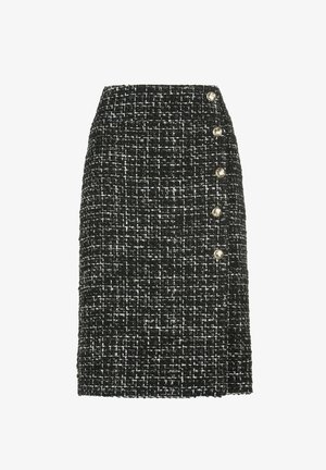 Black and white tweed skirt with a straight cut, featuring five decorative gold-tone buttons along the left side. Structured texture.