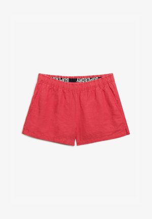 Red shorts with an elastic waistband and side pockets, made of lightweight fabric, featuring a subtle texture and a branding label inside.