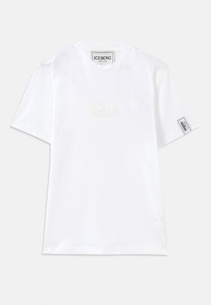 White cotton t-shirt with short sleeves. Features an embossed "OBSESSED" logo on the chest and a side tag with a logo. Simple design.