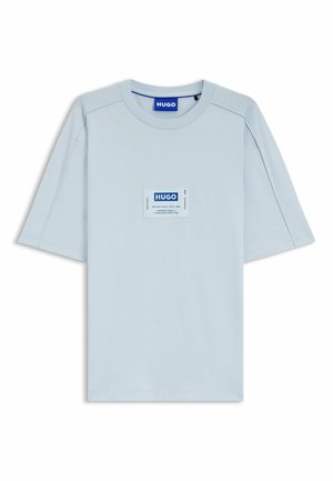 Light blue short-sleeve T-shirt with a round neck and a centered rectangular Hugo logo patch in blue and white on the chest.
