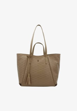 Beige quilted tote bag with two long handles, featuring a decorative tassel and a subtle logo detail on the front. Textured surface.