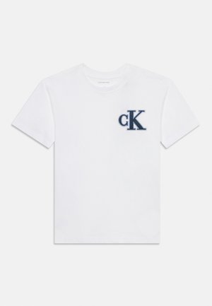 White cotton t-shirt featuring a blue embroidered 'cK' logo on the left chest. Classic crew neck design with short sleeves.