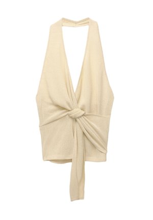 Top halter lavorato a maglia di colore crema con scollatura a V profonda e dettaglio anteriore attorcigliato; leggero, con una superficie texture e lacci in vita.