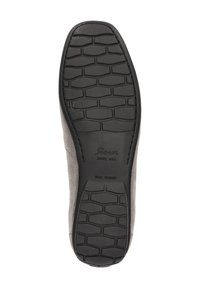 Zwarte rubberen zool van een nette schoen met een gestructureerd loopvlakpatroon en "Sioux Sinds 1954 Echt Rubber" in het ondervlak gestempeld.