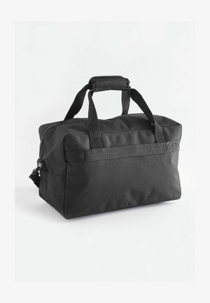 Sort stof duffel taske med dobbel håndtag, lynlåslukning og aftagelig skulderrem. Har en rektangulær form og glat overflade.