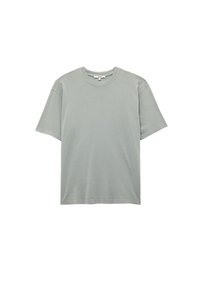 Lichtgrijze t-shirt van katoen, met een ronde hals, korte mouwen en een losse pasvorm met minimale stikdetails.