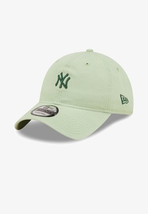 Light green baseball cap made of fabric, featuring a green embroidered logo and adjustable strap. Rounded brim with textured surface.