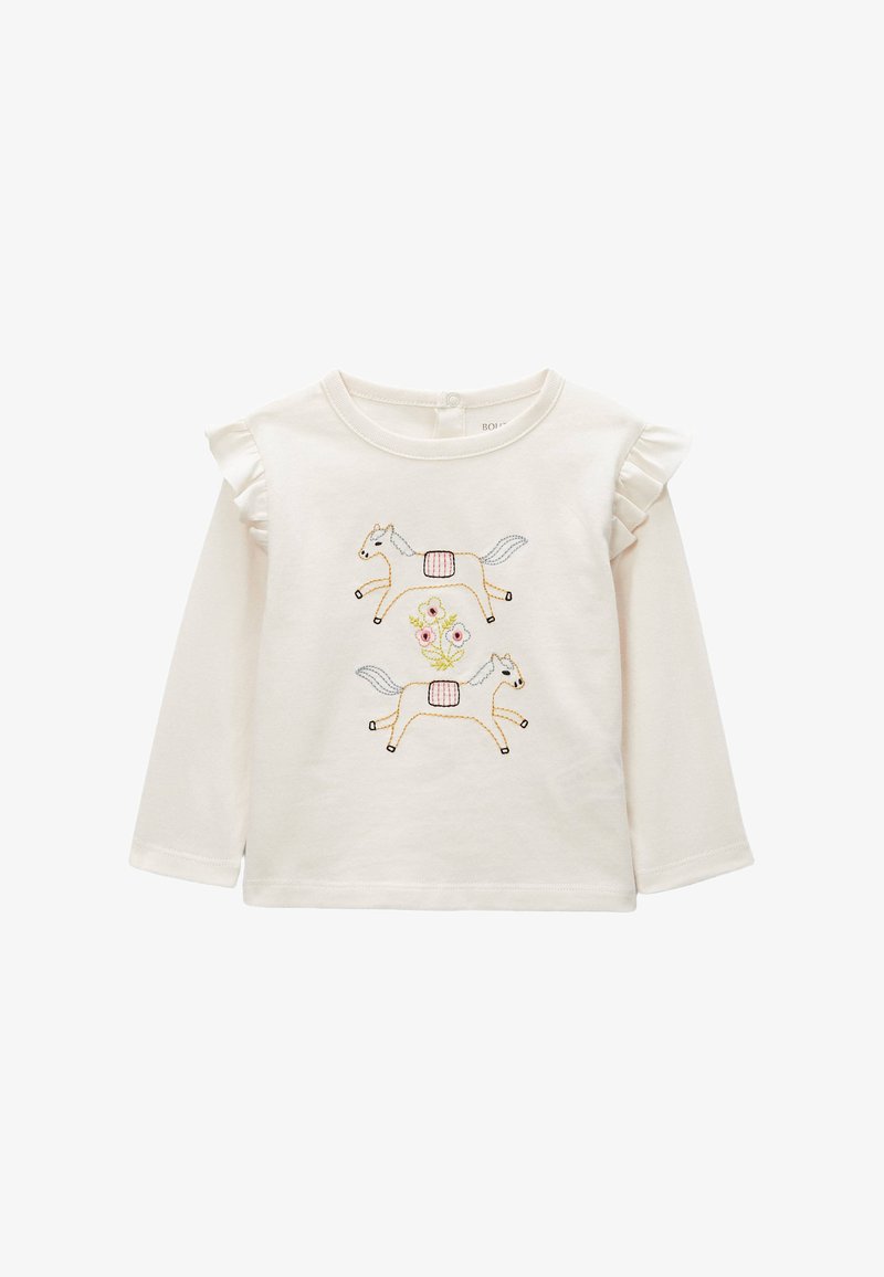 Chemise pour tout-petit à manches longues couleur crème avec épaules à volants et broderie de deux chevaux au galop et trois fleurs roses au centre.