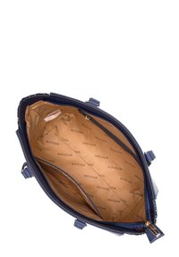 Navy handbag with smooth leather exterior, gold hardware accents, and a lined interior featuring a repeating logo pattern. Zippered closure.